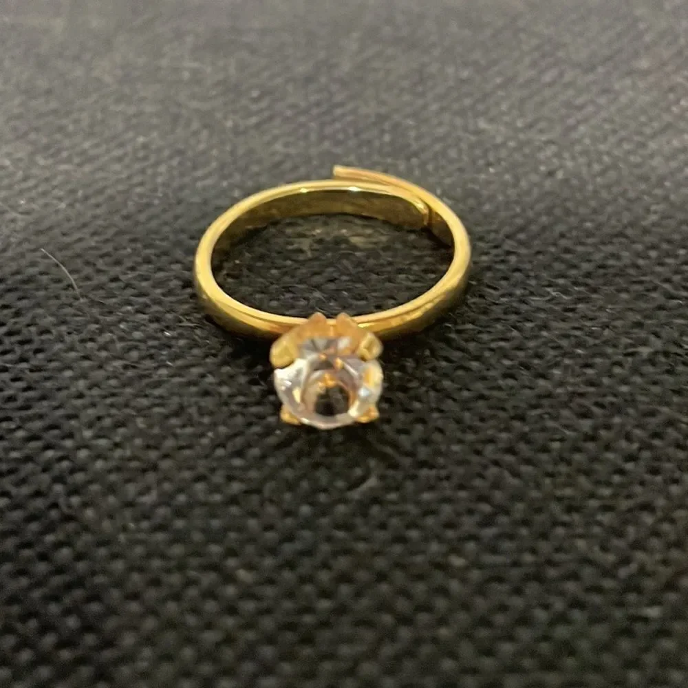 Adjustable band ring with a white gem
